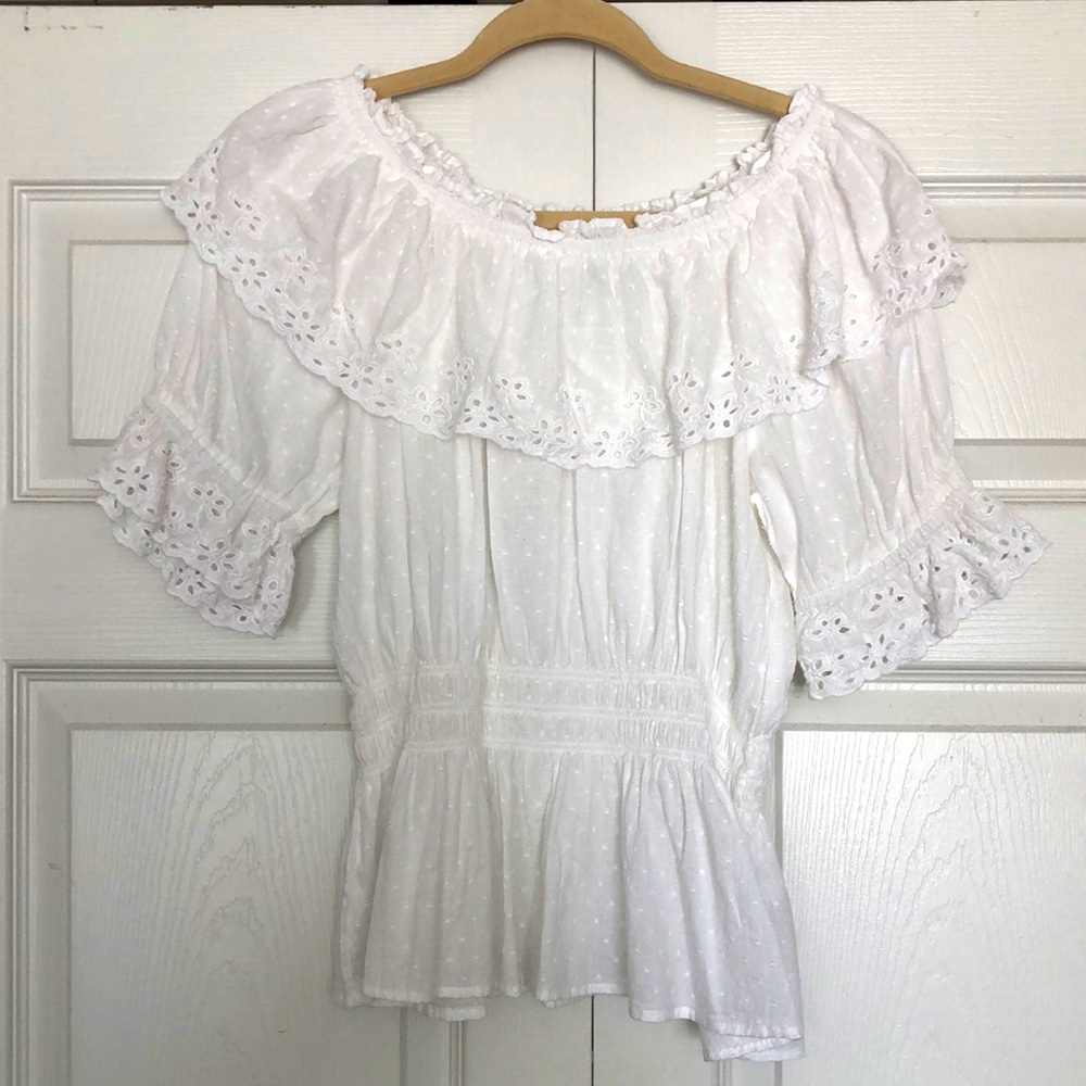 White blouse with delicate eyelet on collar and sleeves. Never worn.